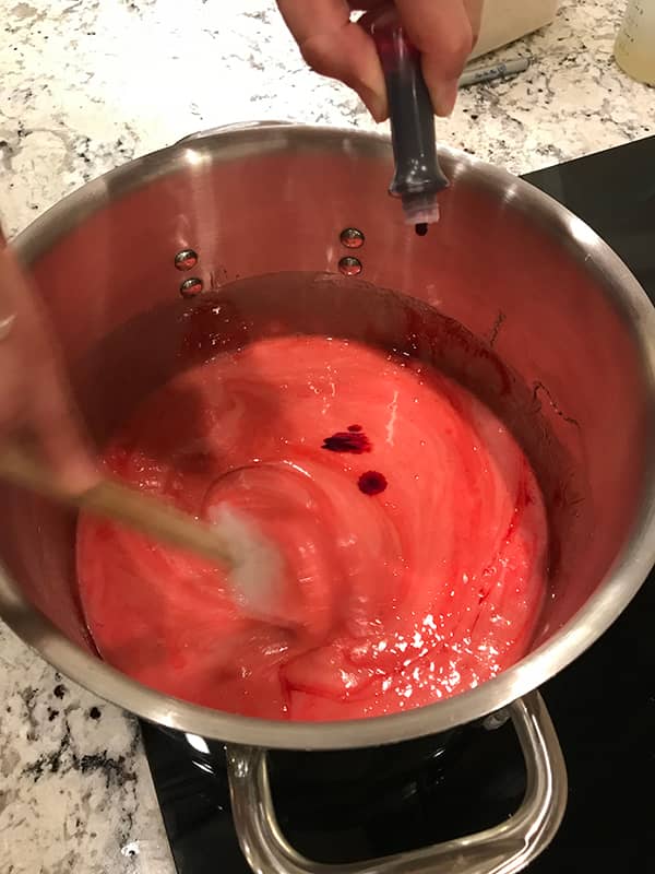 stirring and coloring syrup red or popborn balls