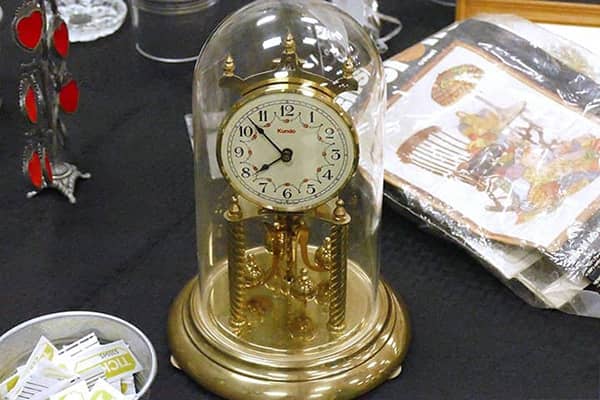 antique desk clock with brass base and covered in a glass dome-gama's-piano-clock-genibliss